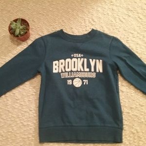 A cute cute blue varsity Brooklyn sweater.